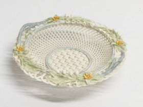 A Belleek Pottery woven basket. 23x23x6cm