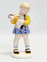 A German pottery ‘Girl with Doll’ figurine by Rosenthal. 20cm