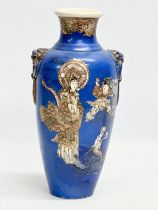 A late 19th century Japanese Meiji period Satsuma vase with embossed figures and hand painted