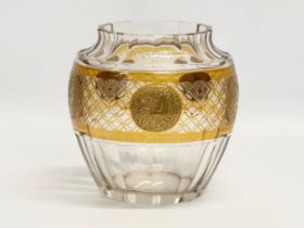 Moser Glass. A large slice cut stained amber glass bowl with cherub motif by Moser Glass. Circa