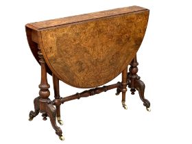 A large Victorian Burr Walnut sutherland table on carved base with cabriole legs. 109cmx92cmx73cm.