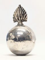 A silver flaming grenade table lighter by Goldsmiths & Silversmiths Co Ltd. London, 1940. Total