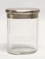 An early 20th century silver lidded glass vanity jar by A. P. London, 1932. Lid weighs 36.9g. 7.