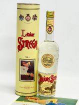 A bottle of 1950’s Liquore Strega with advertising poster and case.