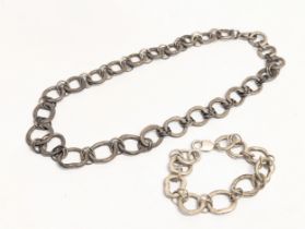 A heavy silver necklace and bracelet set. 116g