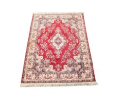 A large Middle Eastern style rug. 238x160cm