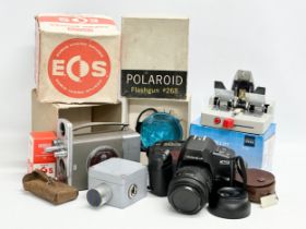 A Yashiba 270 Auto Focus camera, Polaroid Flashgun etc