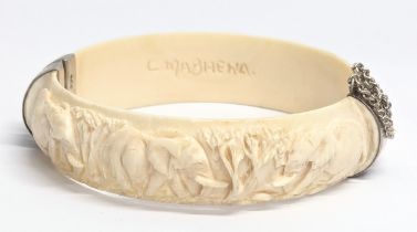 A decorative bangle with silver clasps