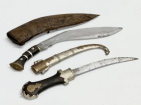 A vintage steel bladed Kindjal dagger with wooden handle and scabbard. Together with a Gurkha