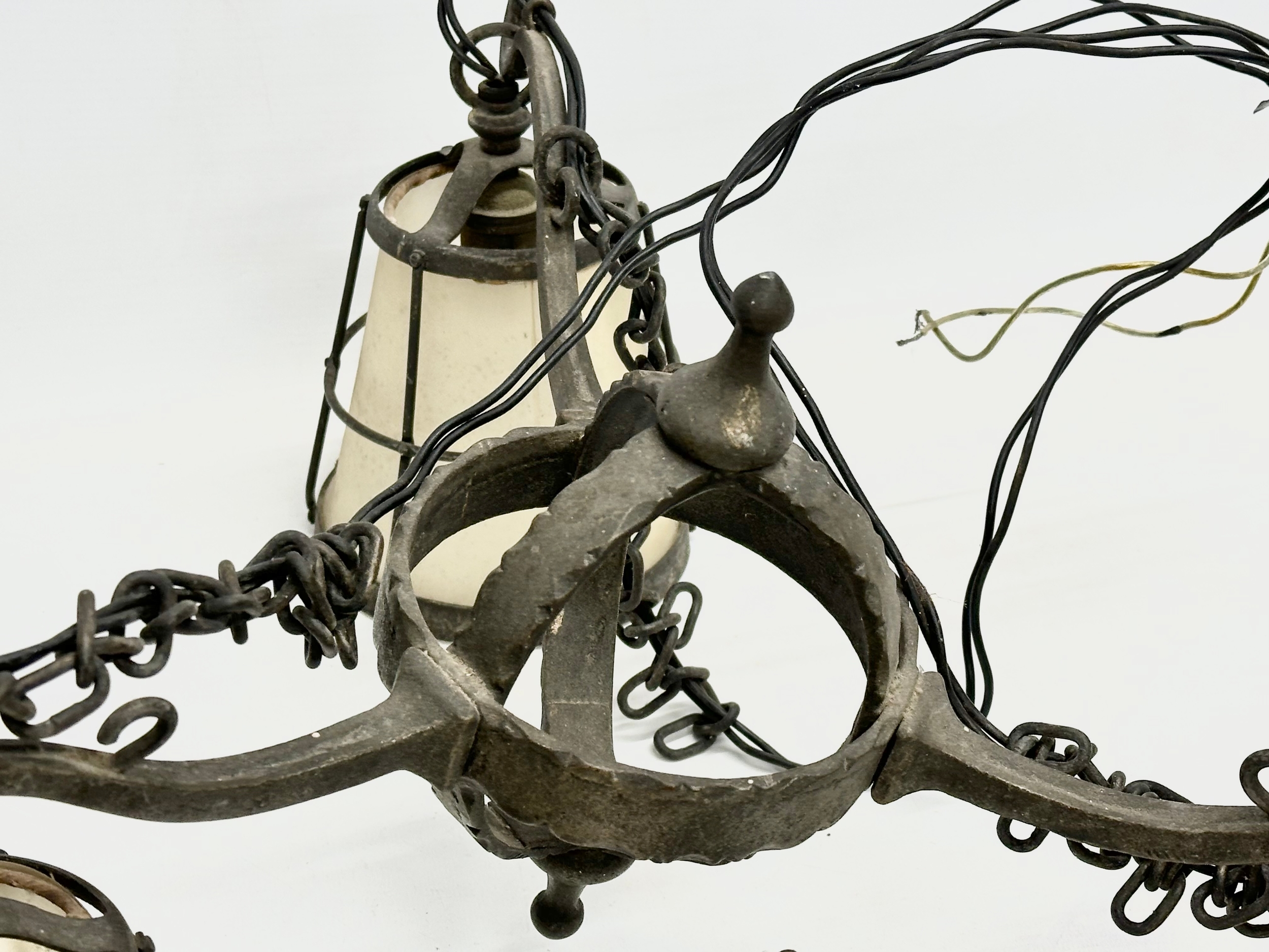 An early 20th century Arts & Crafts Wrought Iron chandelier. - Image 5 of 5
