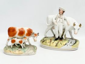 2 19th century Victorian Staffordshire cows. 21x21.5cm