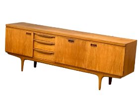 A large Mid Century teak sideboard by Greaves & Thomas. 1960’s. 220x45x77cm