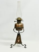 A late 19th century Arts & Crafts copper and wrought iron oil lamp. 24x68cm