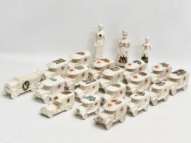 A collection of early 20th century crested china WWI WD trucks and nurses. Including a Nurse