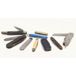 A collection of vintage pocket knives, and multi tool knives, including a fish knife.