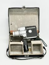 A vintage Canon Cine Zoom 512 camera with case.