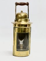 An early 20th century Sherwood Limited brass ships lamp. 26cm including handle.