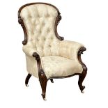 A large Victorian Mahogany deep buttoned back gents armchair on cabriole legs. Circa 1860