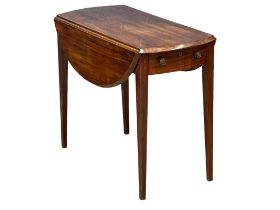 A mid to late 19th century Georgian style mahogany Pembroke table with drawer and dummy drawer.