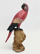 A good quality vintage hand painted parrot on wooden base. 27.5cm