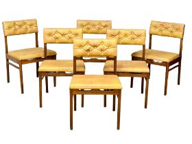 A set of 6 Mid Century teak dining chairs with button back vinyl upholstery. 1960’s.(2)