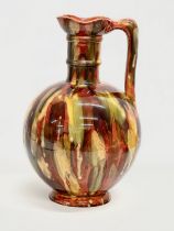 A rare large early 20th century Milton Pottery glazed flagon jug. 24x41cm