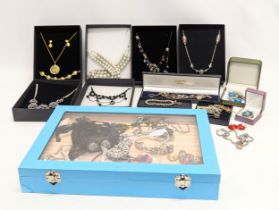 A collection of costume jewellery including necklaces, bracelets, earrings, etc.