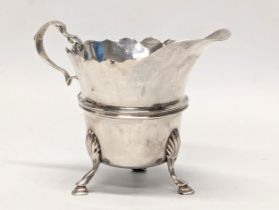 An early 20th century silver cream jug by Sharman D. Neill. Dublin, 1904. 65.4g. 10x7.5cm