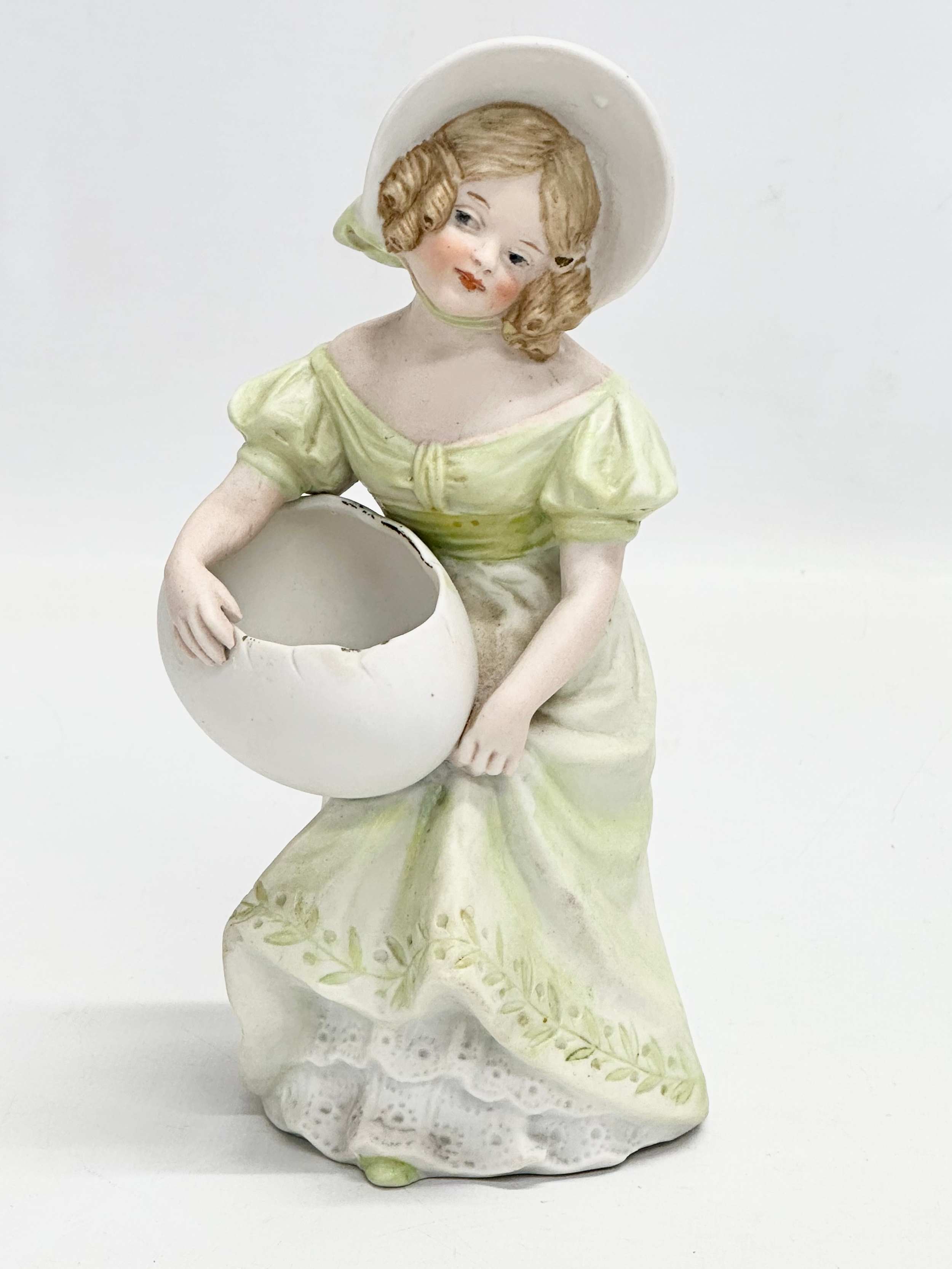 A late 19th century Heubach bisque figurine. 19cm.