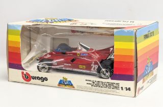 A Burago model racecar, Ferrari 312 T5. 1/14 scale. Box measures 36x16cm