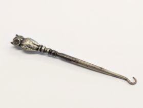 An early 20th century decorative silver mounted button hook by Crisford & Norris Ltd. Birmingham,