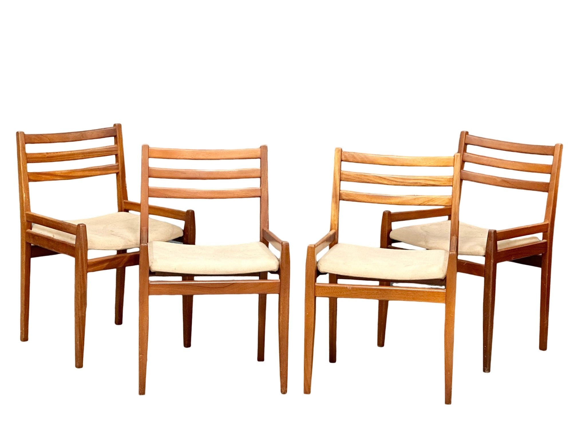 A set of 4 Mid Century teak dining chairs.