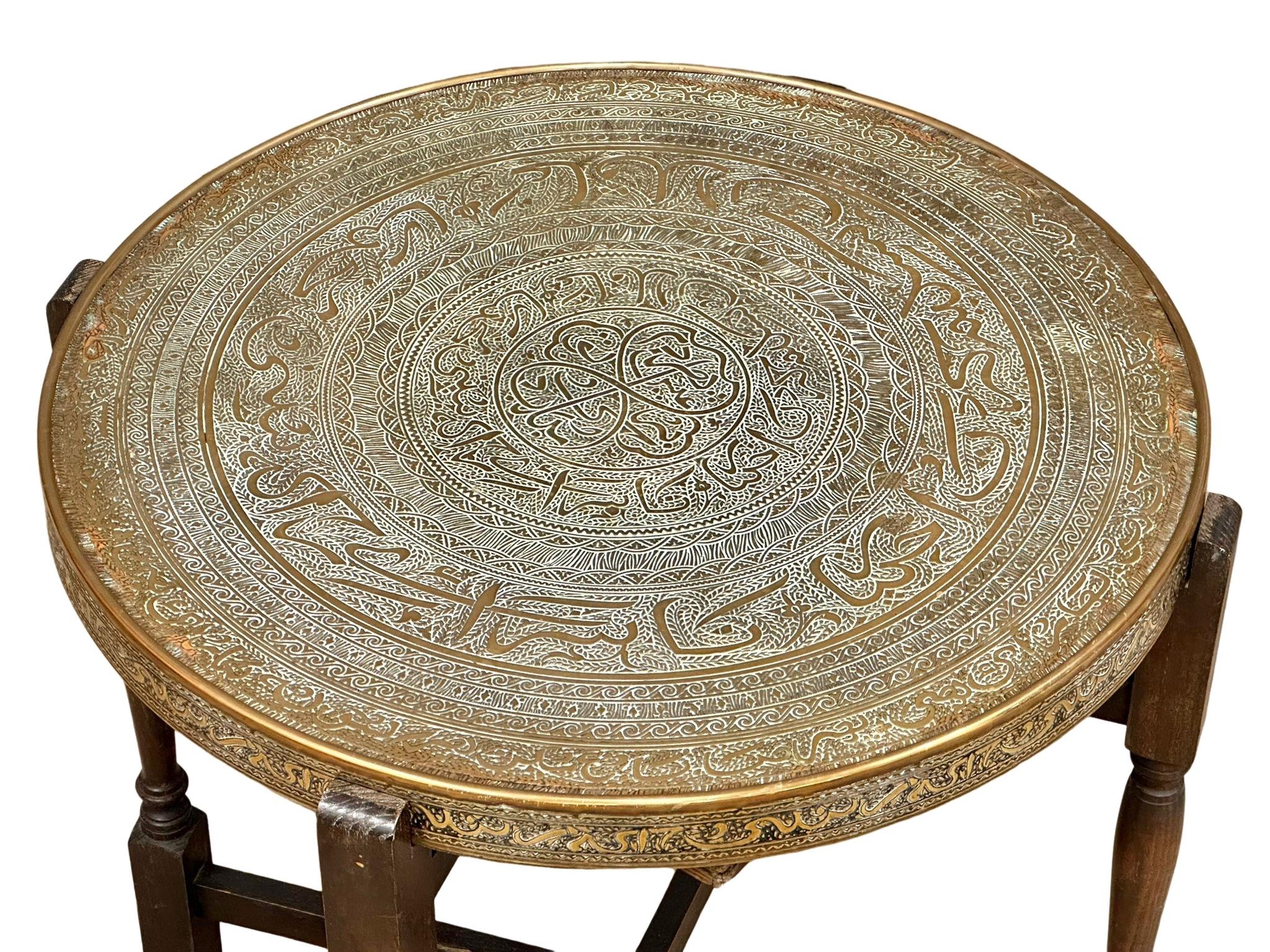 An early 20th Century Middle Eastern style brass top turnover/folding table. 65cm x 60cm x 62.5cm - Image 6 of 6