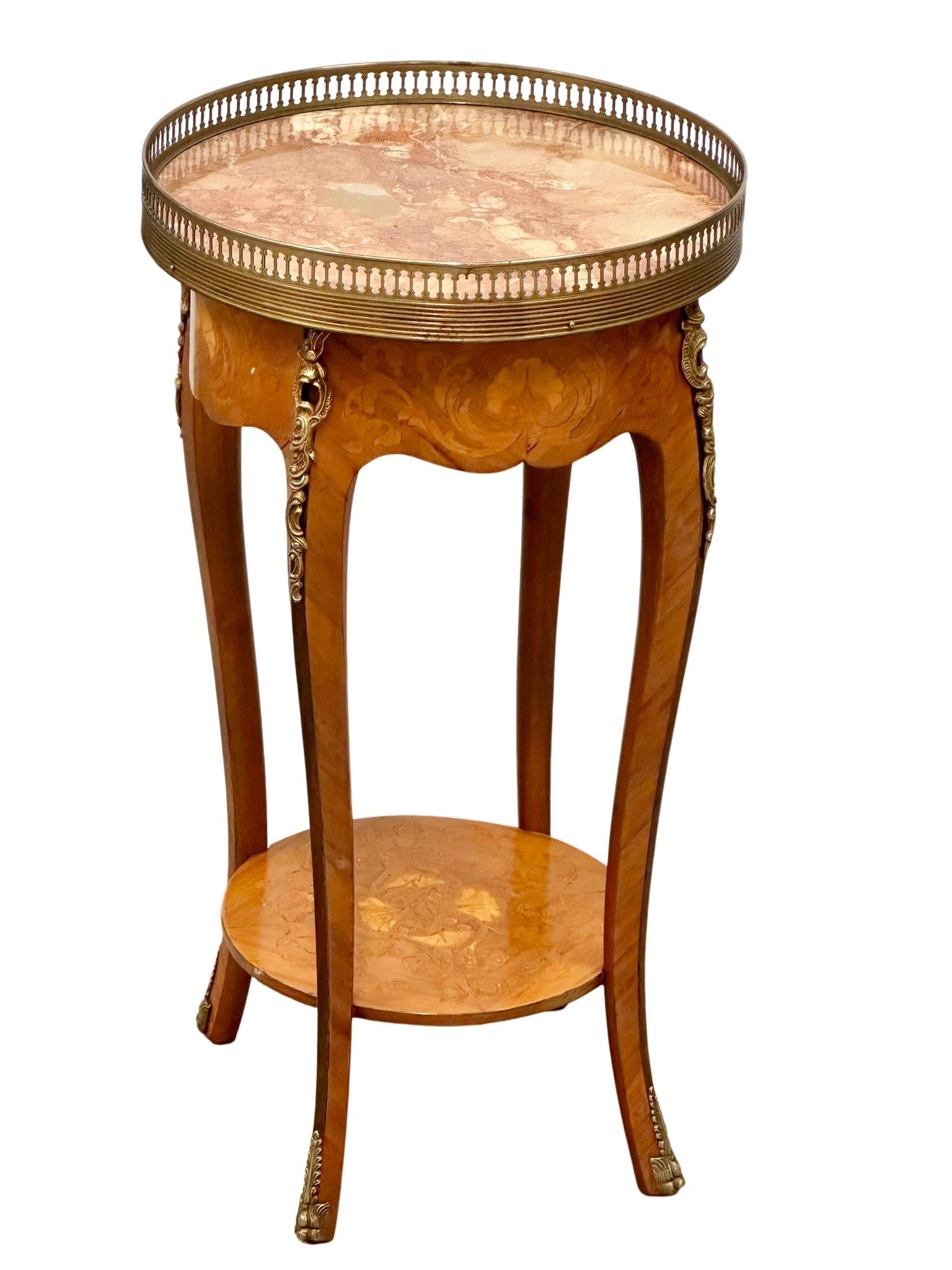 A French 18th century style inlaid occasional table with marble top, brass gallery and ormolu