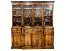 A large Georgian style mahogany secretaire breakfront bookcase with astragal glazed doors and