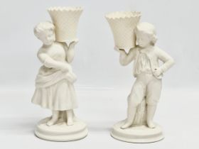 A pair of Belleek Pottery ‘Basket Carrier’ figurines. Girl basket Bearer, Boy Basket Bearer. 21.5cm