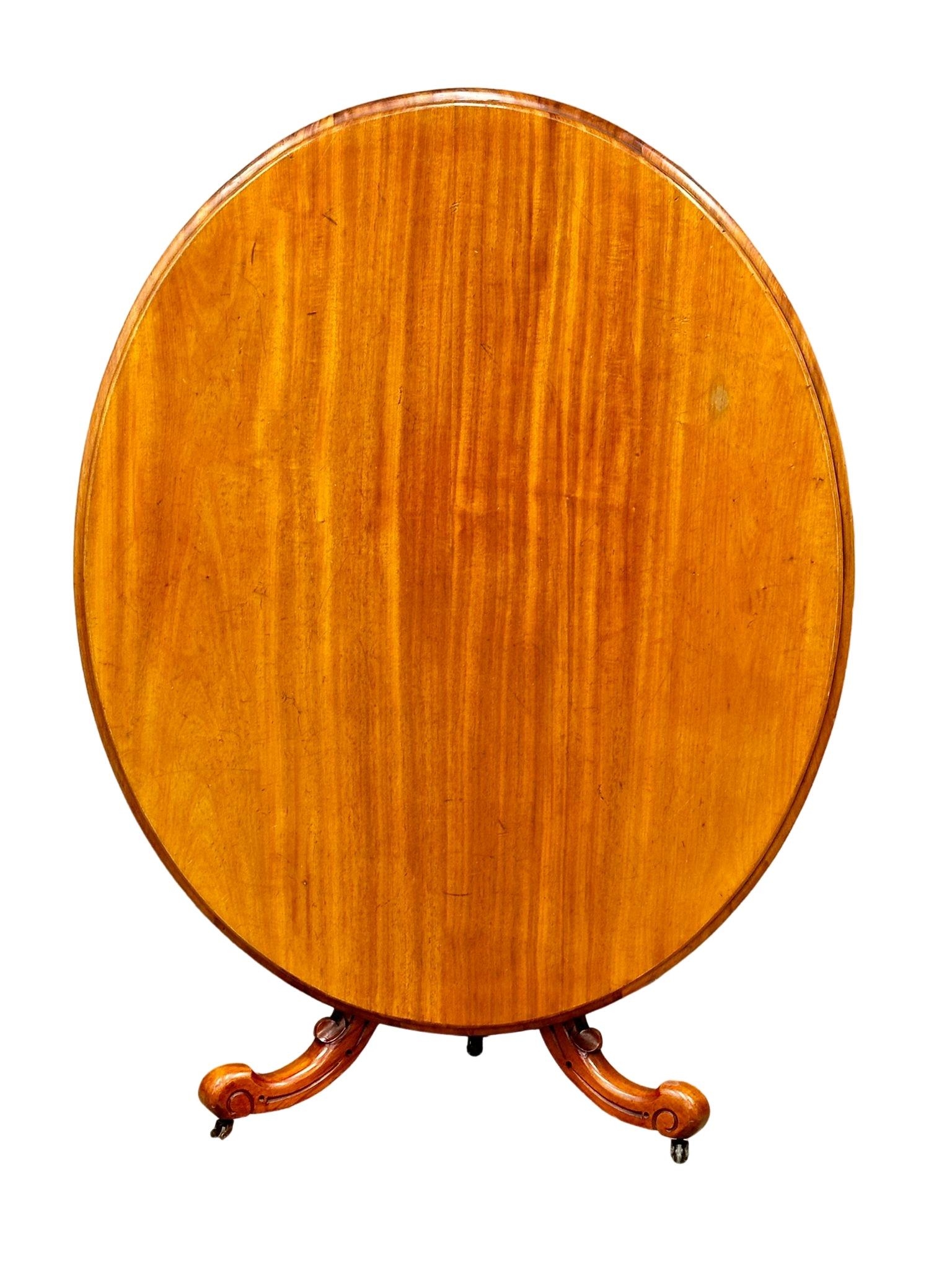 A Victorian tilt top pedestal breakfast table/dining table on cabriole legs, 137cm x 112cm x 75cm - Image 8 of 10