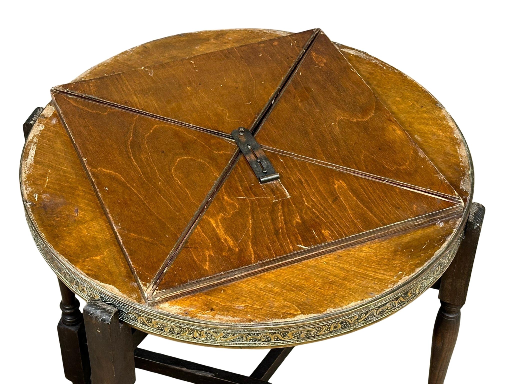 An early 20th Century Middle Eastern style brass top turnover/folding table. 65cm x 60cm x 62.5cm - Image 4 of 6