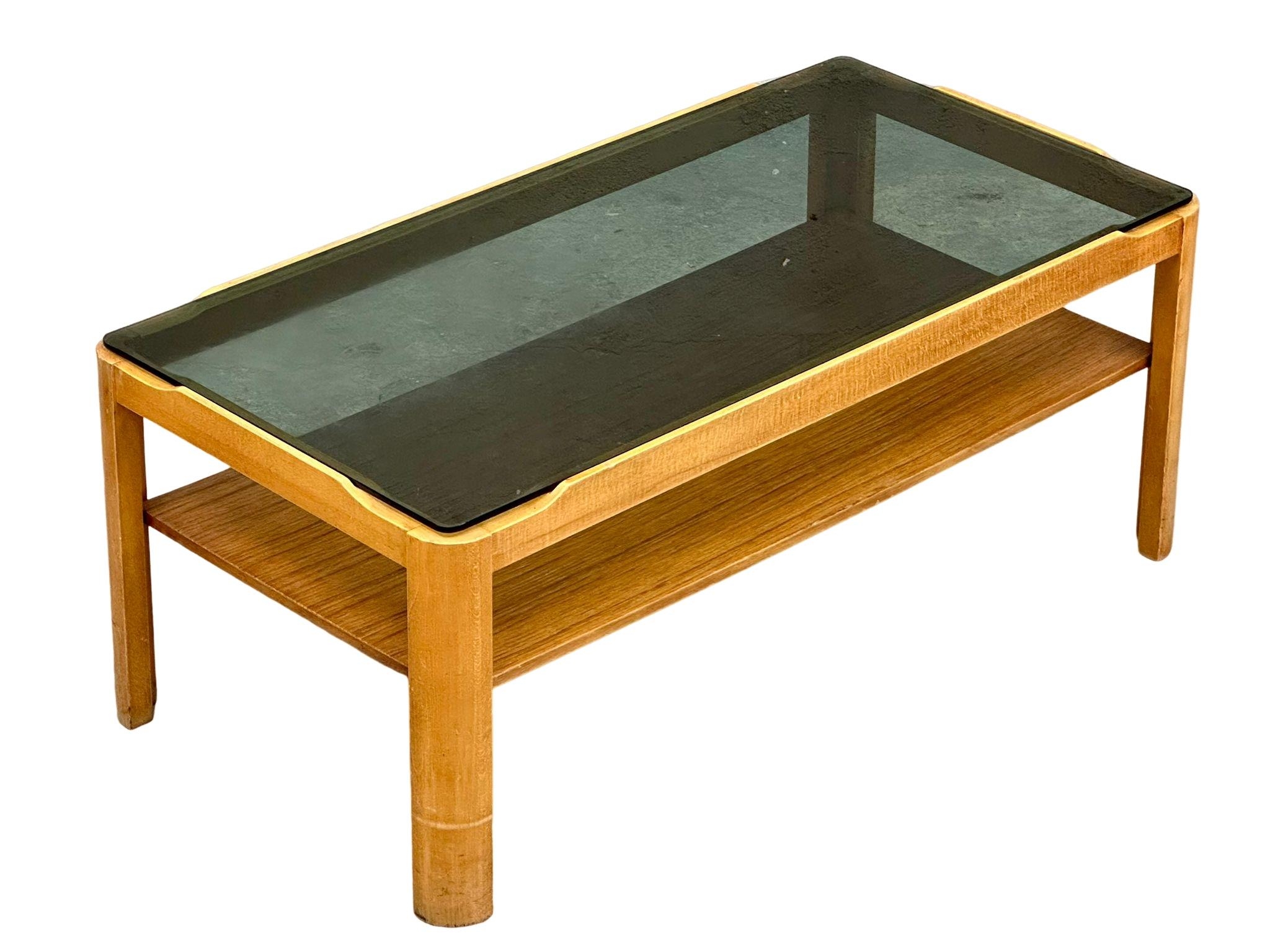 A Mid Century teak coffee table with smoked glass top by Myer. 88x44x35cm - Image 2 of 2