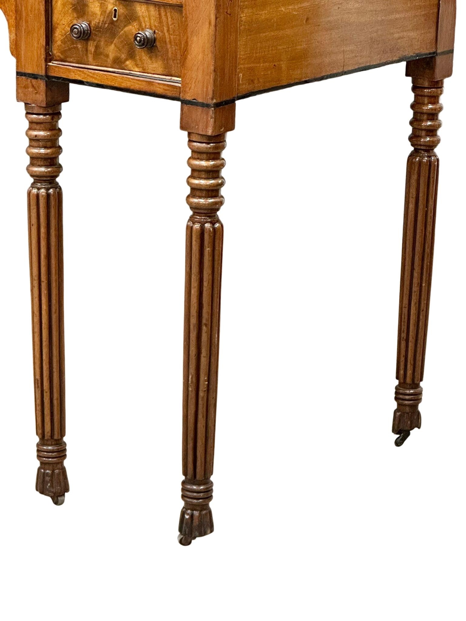 A late George IV mahogany side table/desk on reeded legs. 126cm x 61cm x 80cm - Image 3 of 9