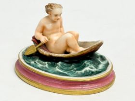 A rare 19th century Royal Worcester Nude Lady Rowing boat figurine. 12.5x10x8.5cm