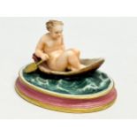 A rare 19th century Royal Worcester Nude Lady Rowing boat figurine. 12.5x10x8.5cm