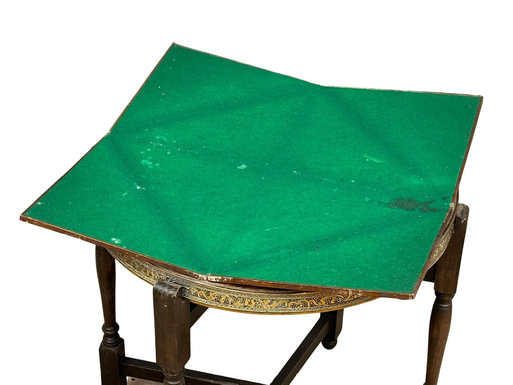 An early 20th Century Middle Eastern style brass top turnover/folding table. 65cm x 60cm x 62.5cm - Image 3 of 6