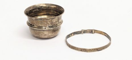 An early 20th century silver salt seller, Birmingham. With a silver baby bangle by Henry