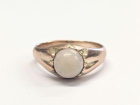 A 9ct gold and opal ring. 4.76g. Size UK N.