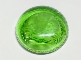 A late 19th/early 20th century uranium glass paperweight. 8x3cm