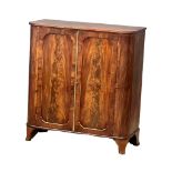 An early 19th century George III mahogany double door side cabinet/linen cupboard with fitted