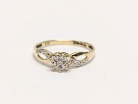 A 9ct gold and diamond ring. 1.3g. UK size P 1/2.