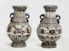 A pair of large late 19th century Vietnamese glazed baluster vases with dragon ring handles.