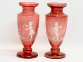 A pair of large late 19th century Mary Gregory Cranberry Glass baluster vases. Circa 1890. 27cm